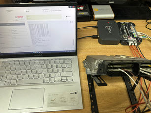 Enola Remaps Nottingham.

Remapping is a process of altering your car engine’s computer, which is better known as an engine control unit (ECU). The ECU is programmed to manage functions such as the fuel injection, sensors, air flow, etc. By changing or overwriting this program with new software, the functions can be customised and the performance of your car can be improved.
Benefits of remapping?
Car manufacturers are known to program their models’ ECUs so that they are not performing at peak efficiency. This allows them to release a sportier model with a more efficient engine by simply reprogramming the ECU and making small design tweaks. Remapping your car means you can get the most out of your engine – improving performance, fuel efficiency and responsiveness.

Improved engine performance is another way of saying more speed and more power. The increase in horsepower you’ll get from remapping depends on what sort of engine you have. For example, you could get an increase of as much as 40-50bhp (brake horse power) for a turbo engine. It may be lower in other engines. Many remapping services also boast an increase in torque of up to 80nm (Newton metres). In other words, it’ll feel faster!

In regard to improved fuel efficiency, this really depends on how you drive your car. Rushing through gears, sudden and fast acceleration, speeding and sudden braking can have a negative effect on your fuel economy, increasing consumption up to 40%. While this is true whether you remap your engine or not, the combination of remapping and smooth driving will offer better fuel efficiency than good driving on its own.