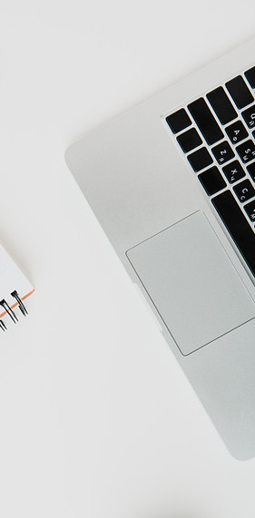 top-view-of-laptop-with-office-supplies-