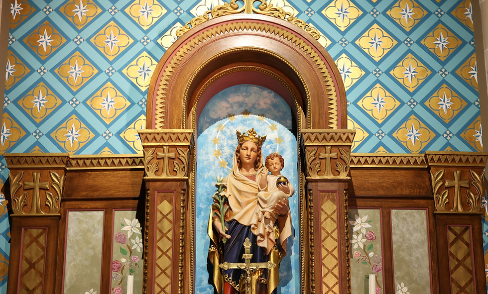Mary Altar with Our Lady of Czechoslovkia Statue holding baby Jesus.