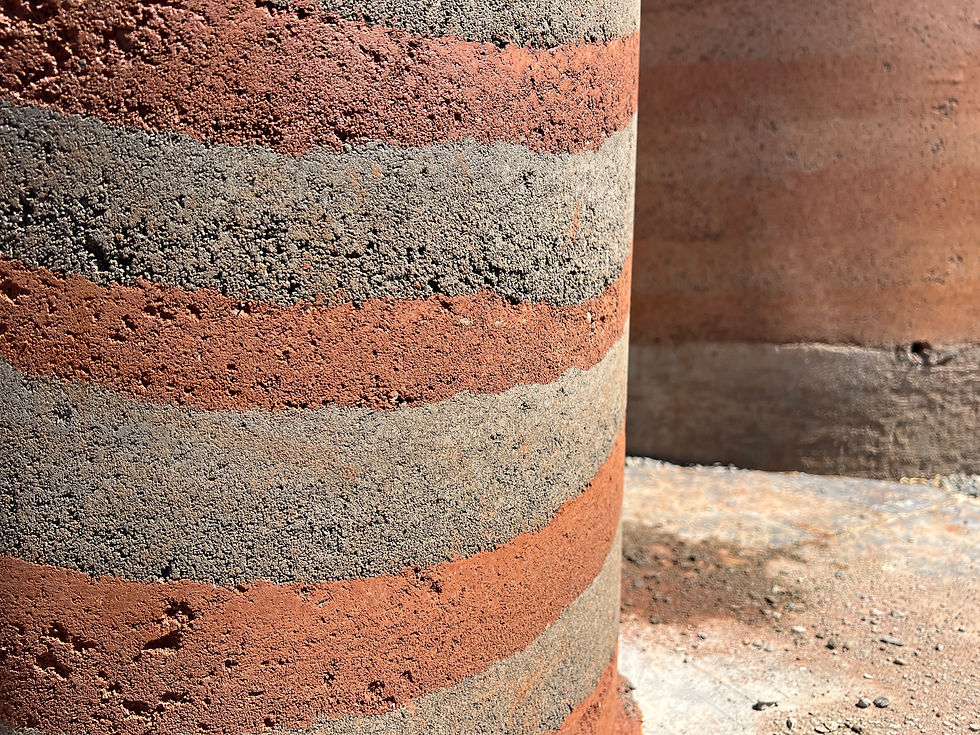 Stabilized rammed-earth wall showcasing earthy textures, layered finishes and environmentally conscious construction methods suitable for Tanzania.