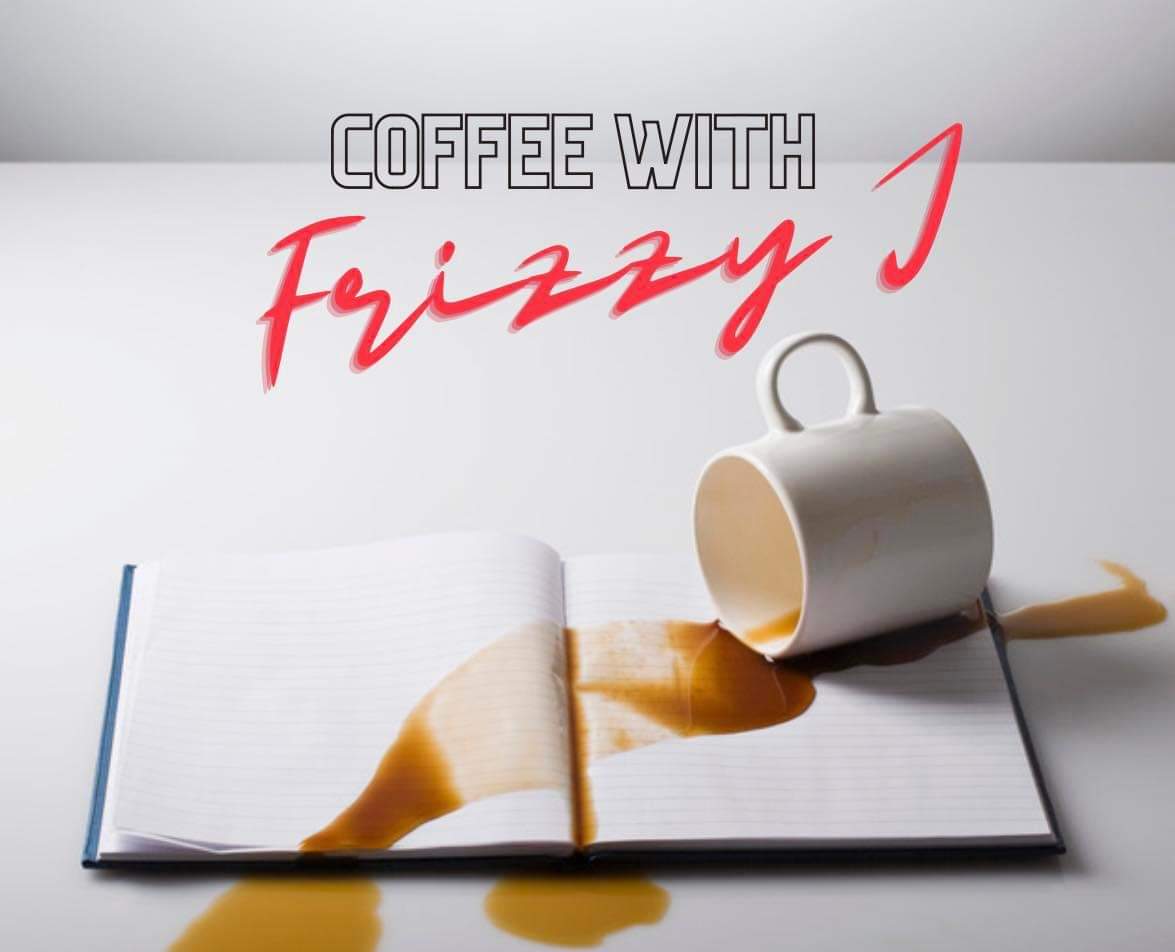Coffee with Frizzy J Logo above a white table with a notebook, open, with coffee spilled on it.