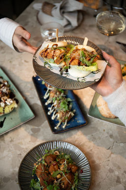 Grace Rotterdam - international sharing dishes being served