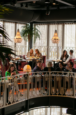 Grace Rotterdam - guests dining on the balcony above the restaurant floor