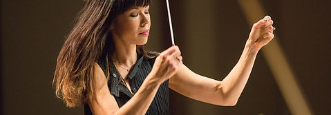 Sarah Hicks conducting photo by Greg Helgeson