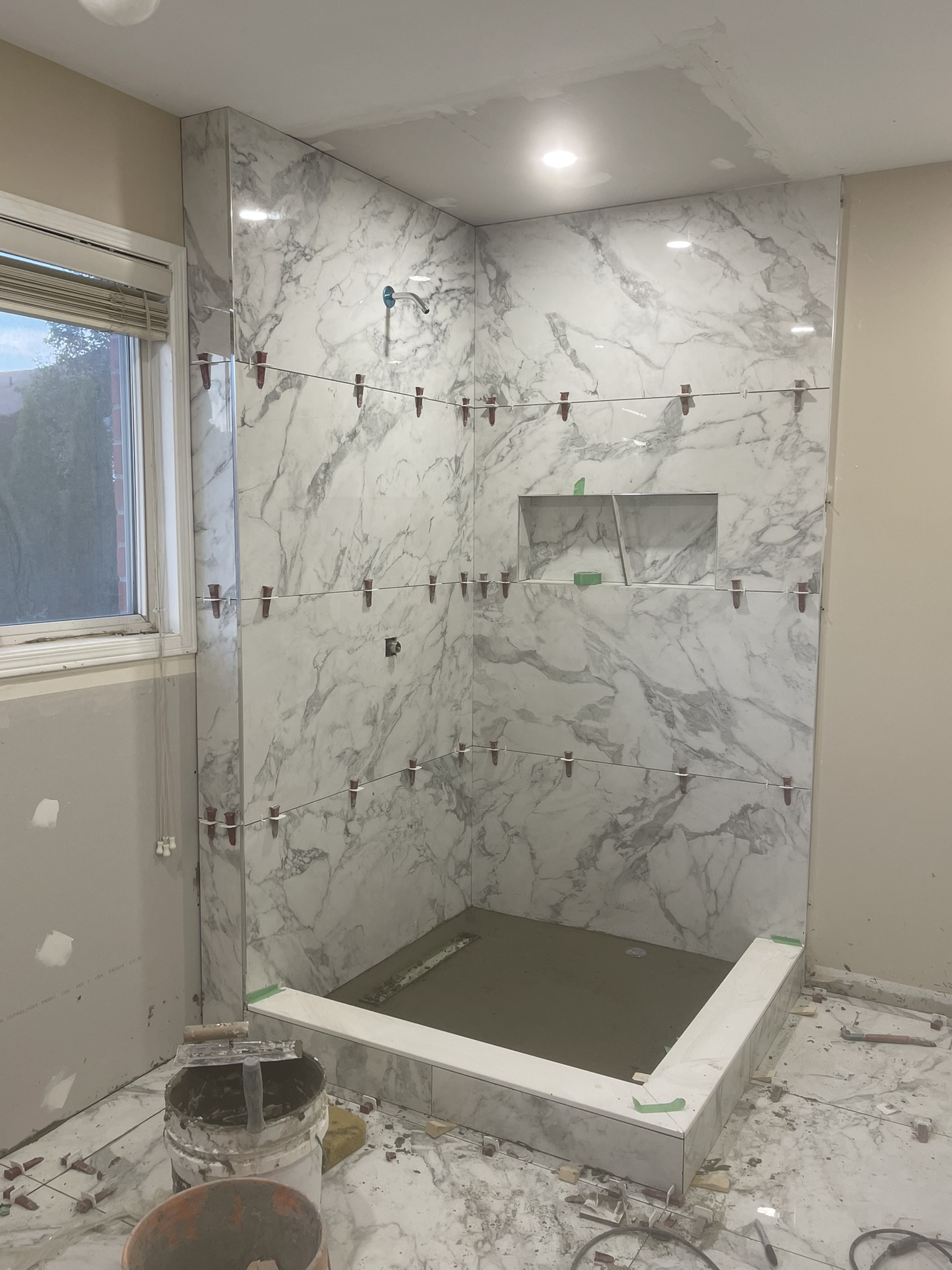 Bright marble shower renovation 1