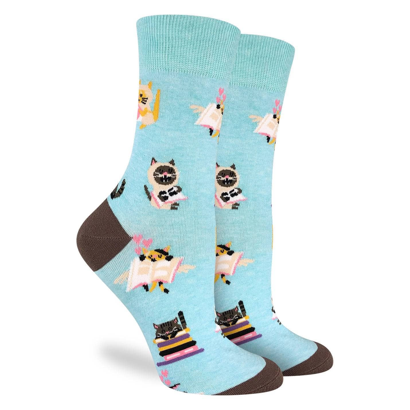 Light blue socks with cartoon cats reading books.