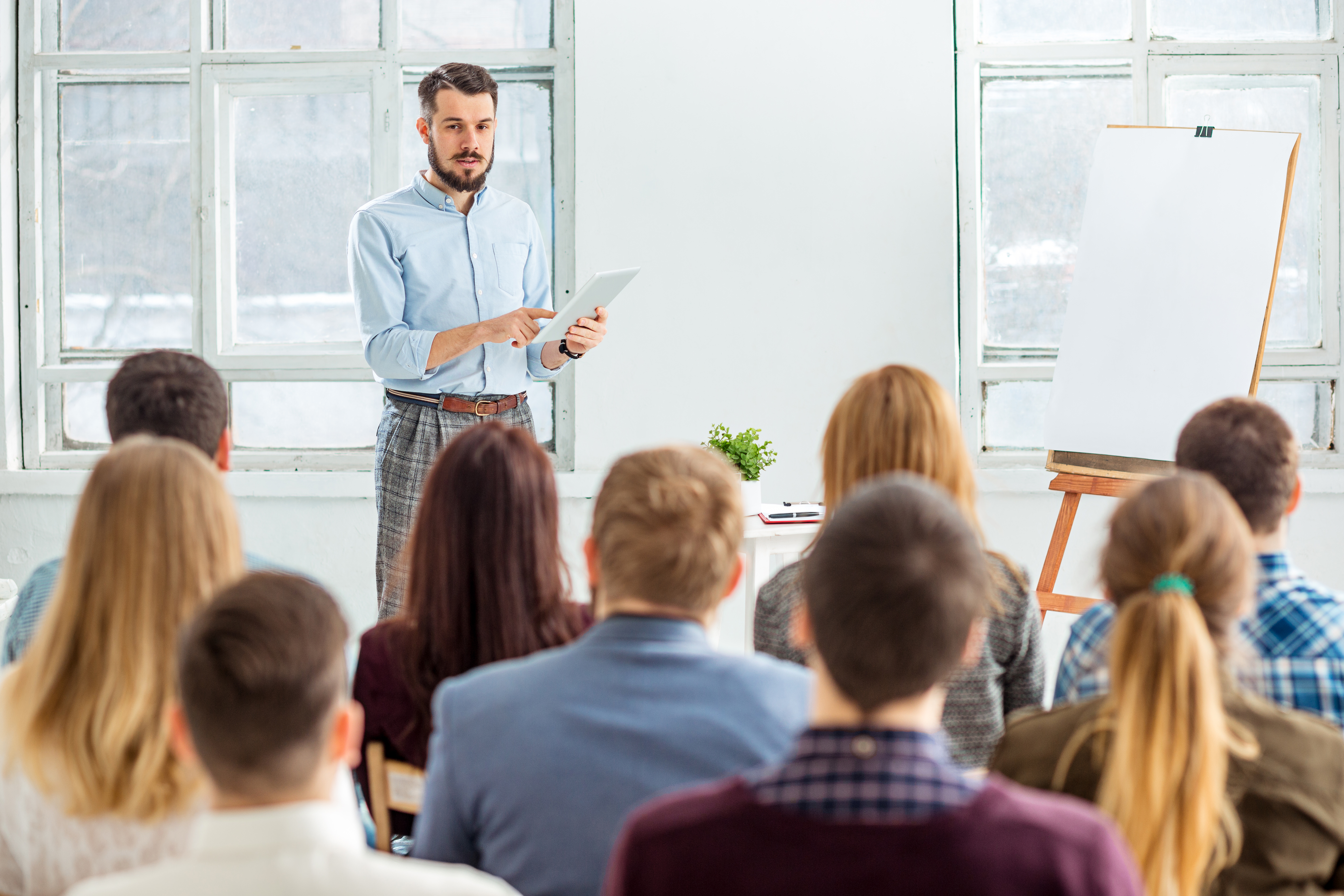 Speaker presenting at a business conference