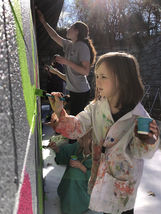 Young Girl Paining a Mural
