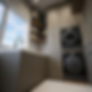 Laundry room design Ireland — open oak shelving textured wallpaper recessed lighting