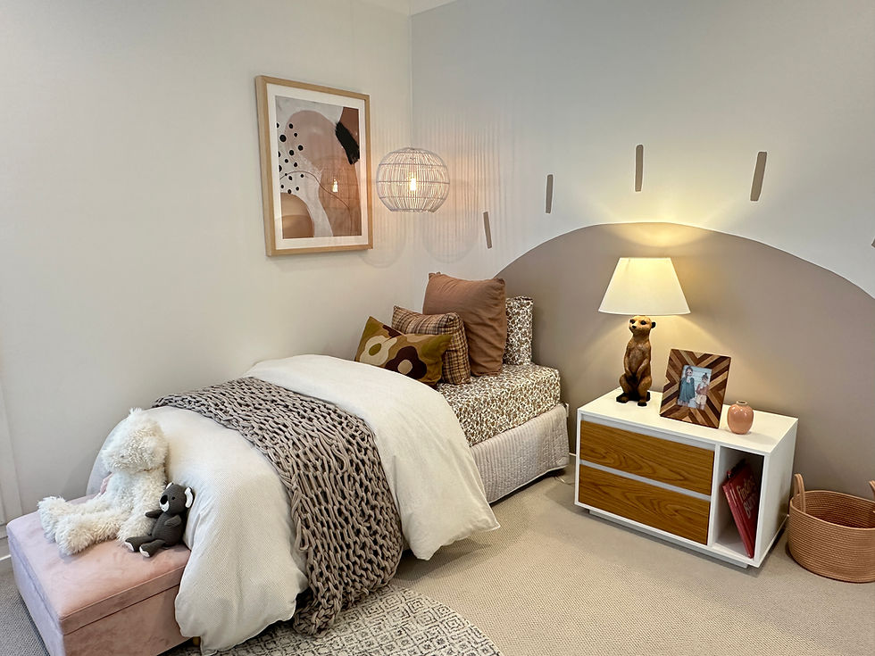Eye-level view of a living room with soft pastel walls and natural light