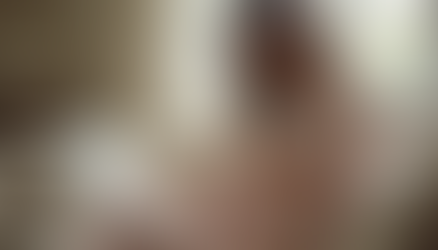 A pregnancy woman sitting on a couch