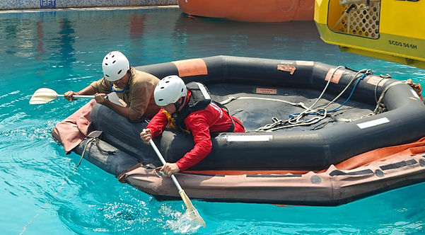 Offshore workers practicing emergency response skills in a state-of-the-art simulator for OPITO safety training certification