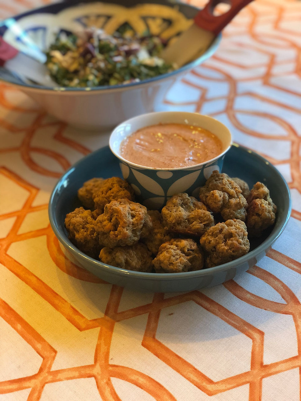 turkey cheddar balls on blue plate with dipping sauce and salad