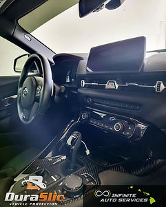 Car interior with dashboard, steering wheel ceramic coated with Duraslic coatings