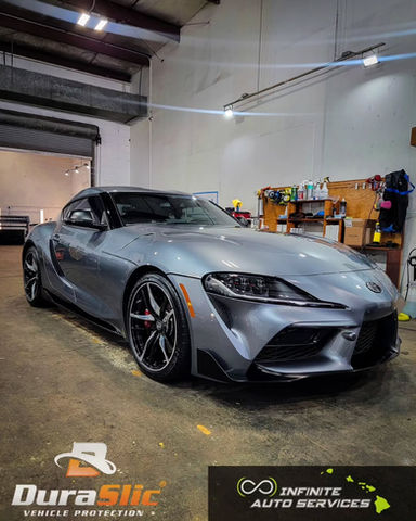 Gray Toyota Supra in a garage, DuraSlic, Infinite Auto Services, vehicle protection.