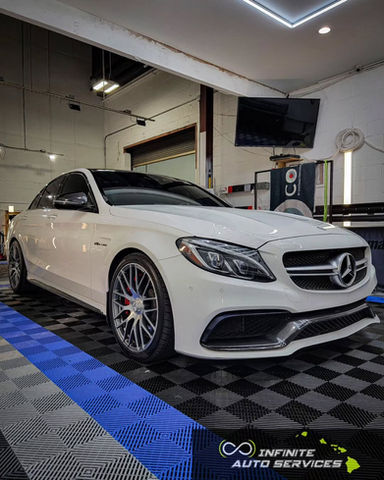 White Mercedes C63 AMG at Infinite Auto Services in for ceramic coating