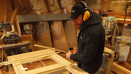 man working with timber in a joinery workshop