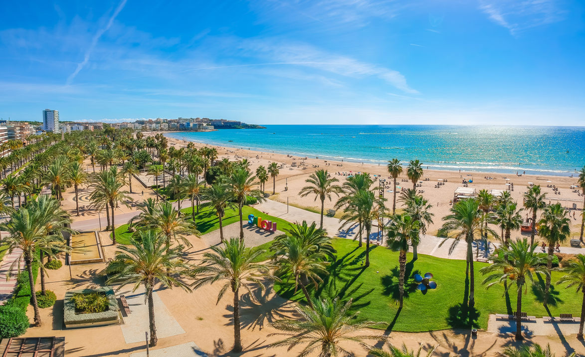 Beach, blue sea and palm trees in Salou city, Catalonia, Spain, Europe.jpg