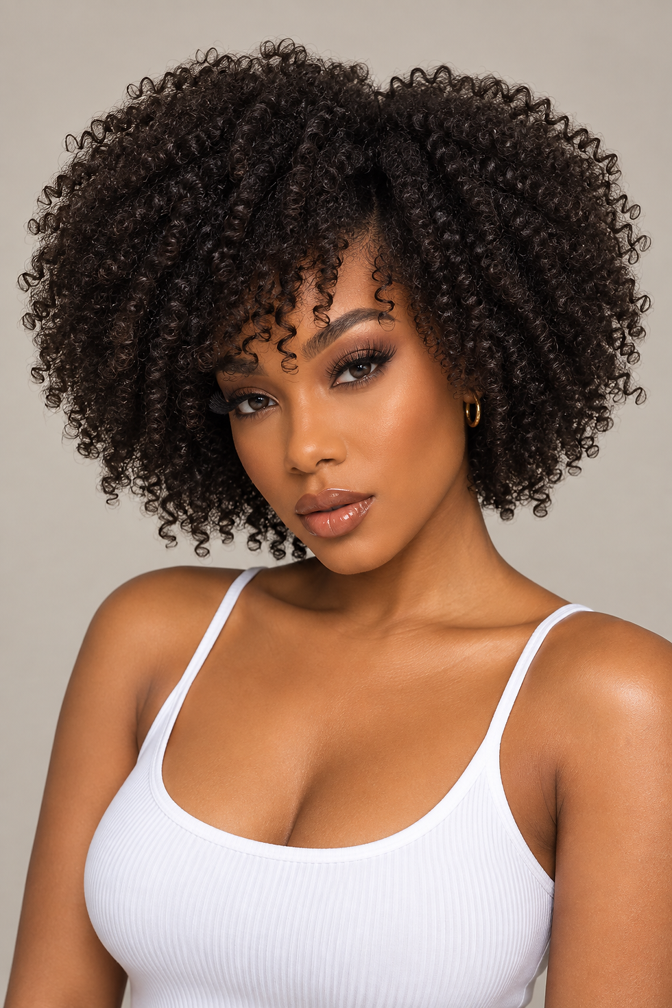 Hair By Blyss Signature Kinky Curly human hair extensions styled in a short, full natural curly look