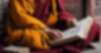 Tibetan monk, in proper robes, reading old scriptures, Tibetan pecha, monk reading._edited