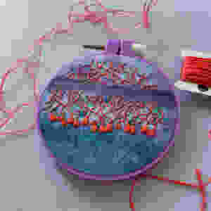 Photo of Lauren's watercolored cerebellum embroidery hoop.