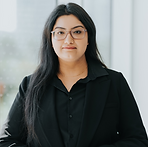 A woman wearing glasses and a black shirt.