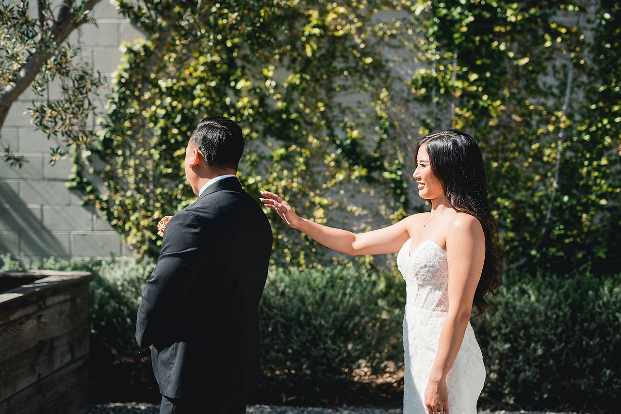 Bride and Groom about to do a first look shot at The Harper in Costa Mesa by Alvis Pham Photography, Orange County California Wedding Photographer