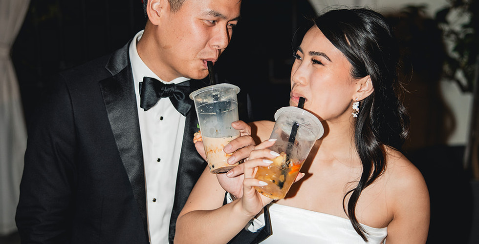 Newly weds drink boba the their reception shot by Alvis Pham Photography, Orange County California Wedding Photographer