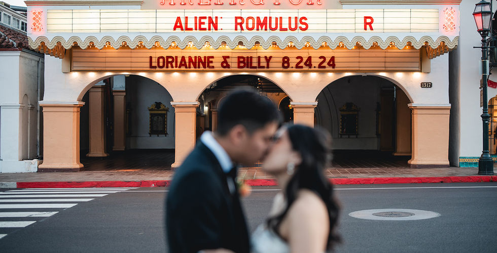 Newly weds kiss in front of the Arlington Theater shot by Alvis Pham Photography, Orange County California Wedding Photographer