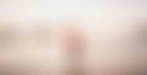 Groom holds bride in Newly wed photoshoot at Newport Beach during golden hour shot by Paper Birch Collective, California Wedding Photographer in Orange County