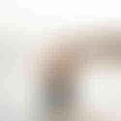 Couple kisses in the waves before Proposal shot by Paper Birch Collective, California Wedding Photographer and Videographer Team in Orange County