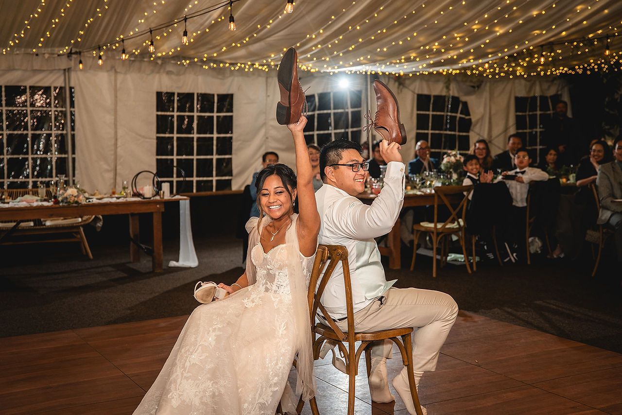 Wedding Reception bride and groom shoe game photo taken by Paper Birch Collective, California Wedding Photographer in Orange County