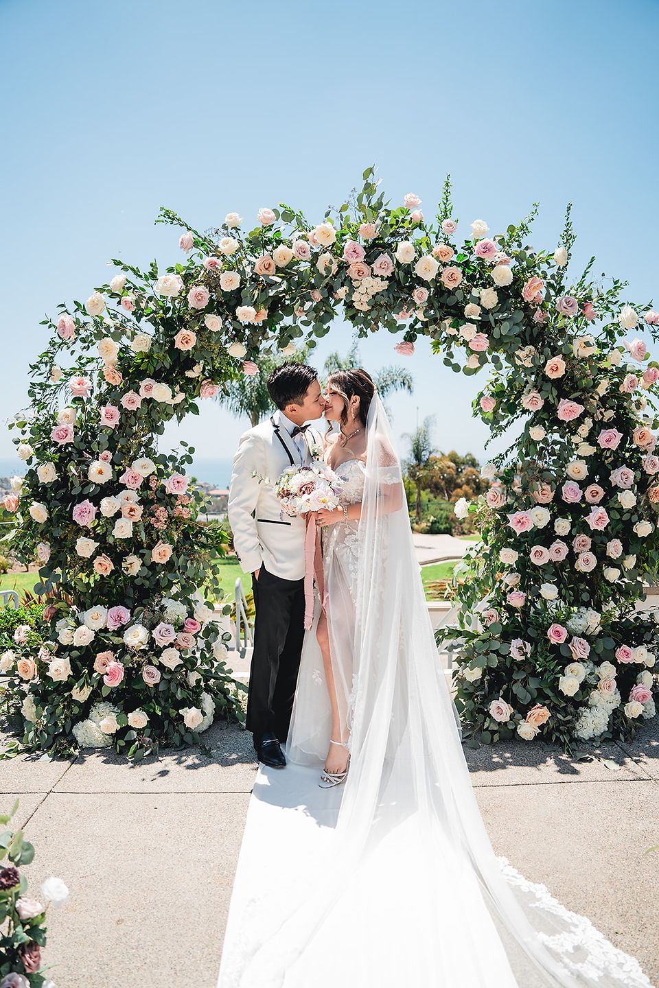 Bride and groom kiss at the alter before the Ceremony at Grey Museum shot by Alvis Pham Photography, Orange County California Wedding Photographer