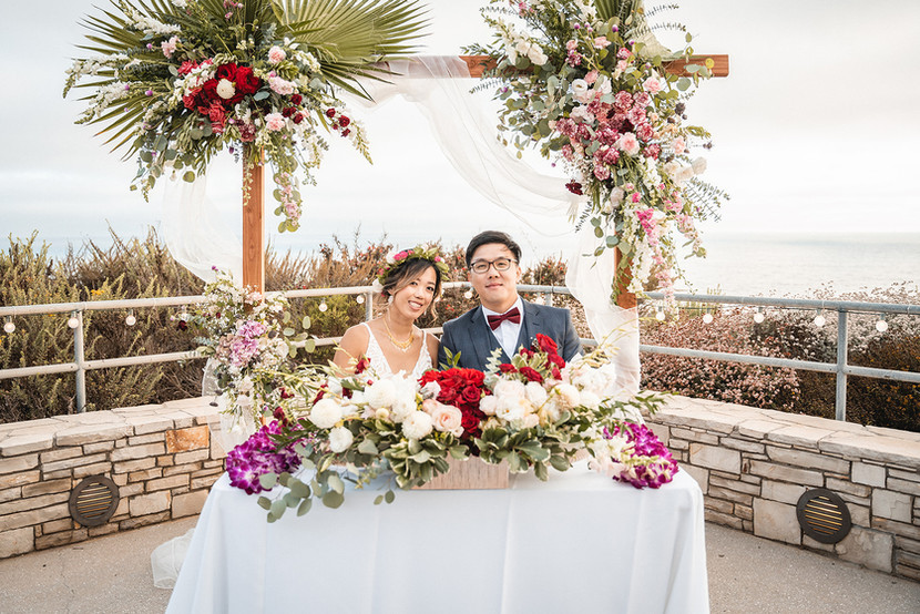 Exchanging leis at outdoor wedding reception for cliff side summer wedding overlooking Point Vicente Lighthouse in Rancho Palos Verdes, California, shot by Paper Birch Collective, Orange County Wedding Photographer, Los Angeles Wedding Photographer