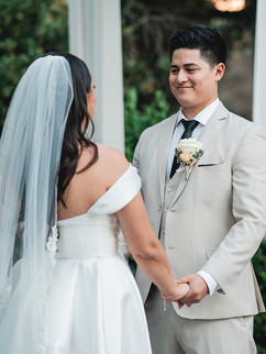 Bride and groom hold hands at Outdoor Garden Wedding Ceremony shot by Alvis Pham Photography, Orange County California Wedding Photographer, at Sierra La Verne by Wedgewood Weddings