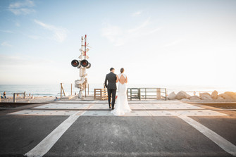 Wedgewood Wedding - Romantic Newlywed Photoshoot at San Clemente Beach on train tracks - Paper Birch Collective