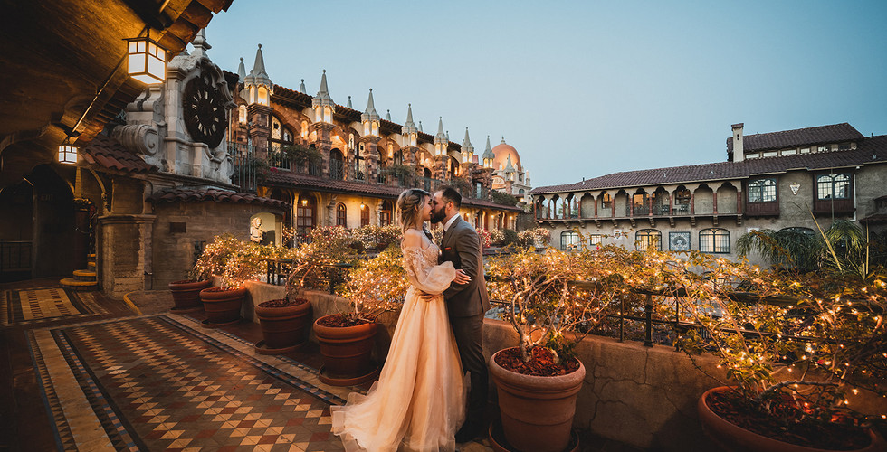 Couple kiss at The Mission Inn Hotel for an engagement photoshoot by Paper Birch Collective, California Wedding Photographer in Orange County