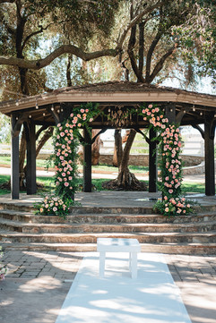 Gazebo with pink flowers at Giracci Vineyards shot by Alvis Pham Photography, Orange County California Wedding Photographer