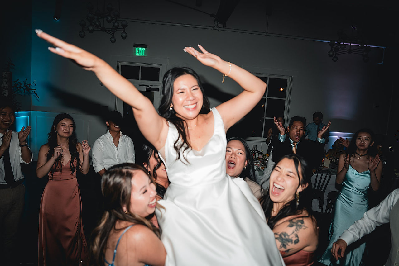 Bride on a chair in the air at The Richland photo by Alvis Pham Photography, Orange County California Wedding Photographer