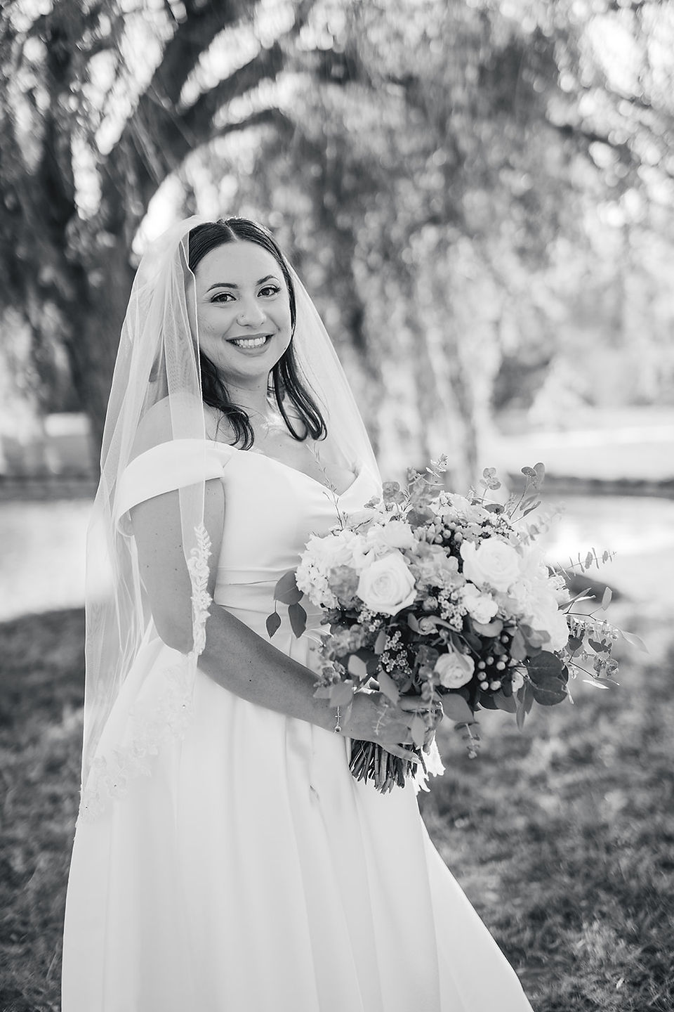 Bride with bouquet solo photoshoot by a willow tree shot by Alvis Pham Photography, Orange County California Wedding Photographer, at Sierra La Verne by Wedgewood Weddings