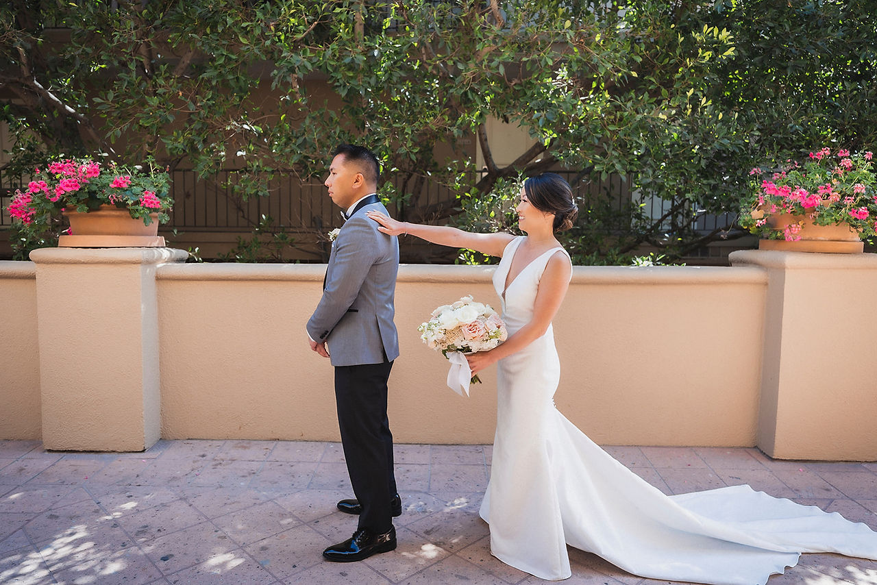 Wedding photo of first look with bride and groom by Paper Birch Collective, California Wedding Photographer in Orange County taken at Occasions at Laguna Village in Laguna Beach California