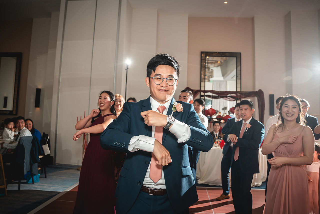 Groomsman dances at The Waterfront Beach Resort shot by Paper Birch Collective, California Wedding Photographer and Videographer Team in Orange County