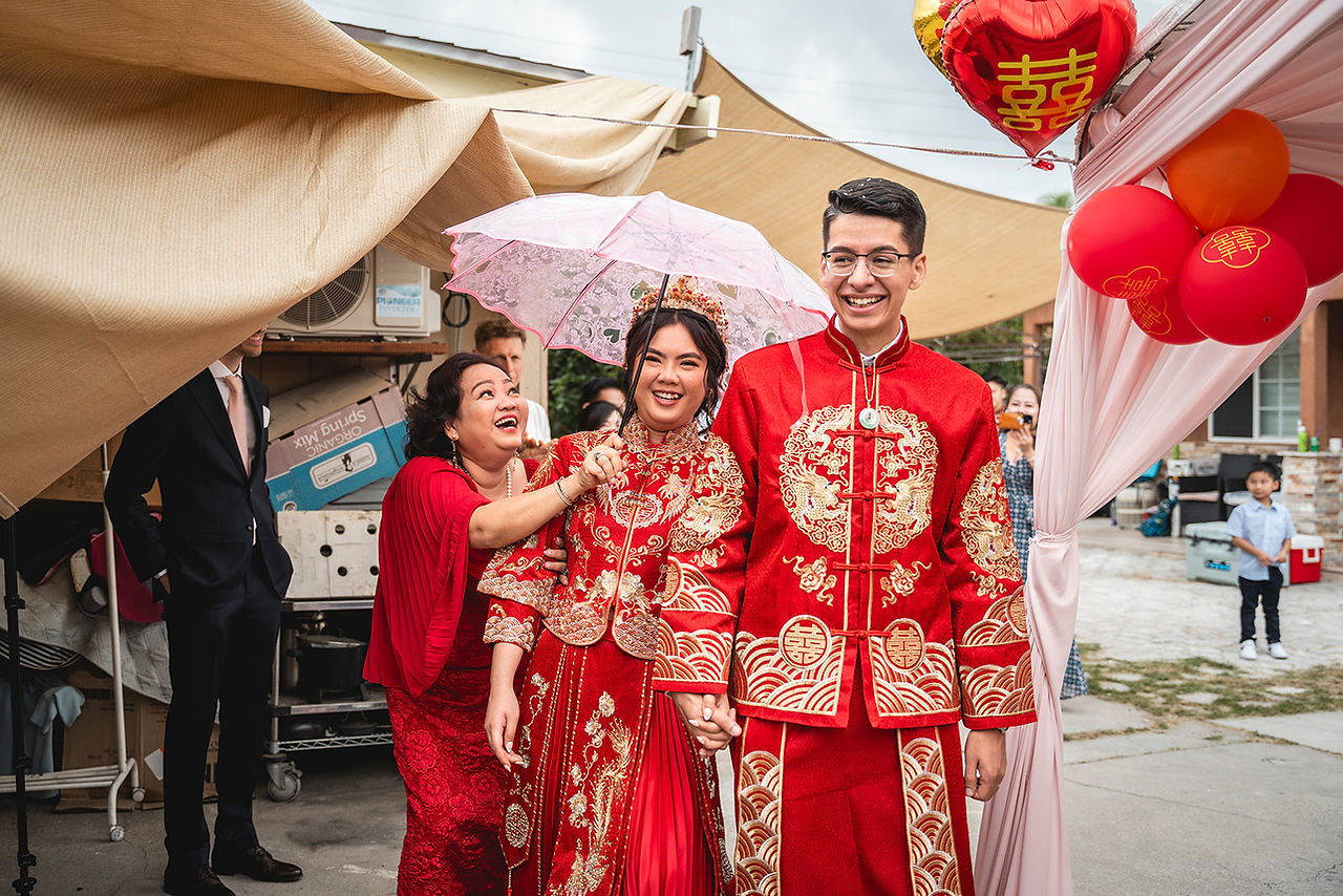 Newly weds grand exit from wedding tea ceremony shot by Paper Birch Collective, California Wedding Photographer and Videographer Team in Orange County