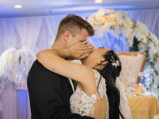 Bride and groom kiss behind hand shot by Paper Birch Collective, California Wedding Photographer in Orange County
