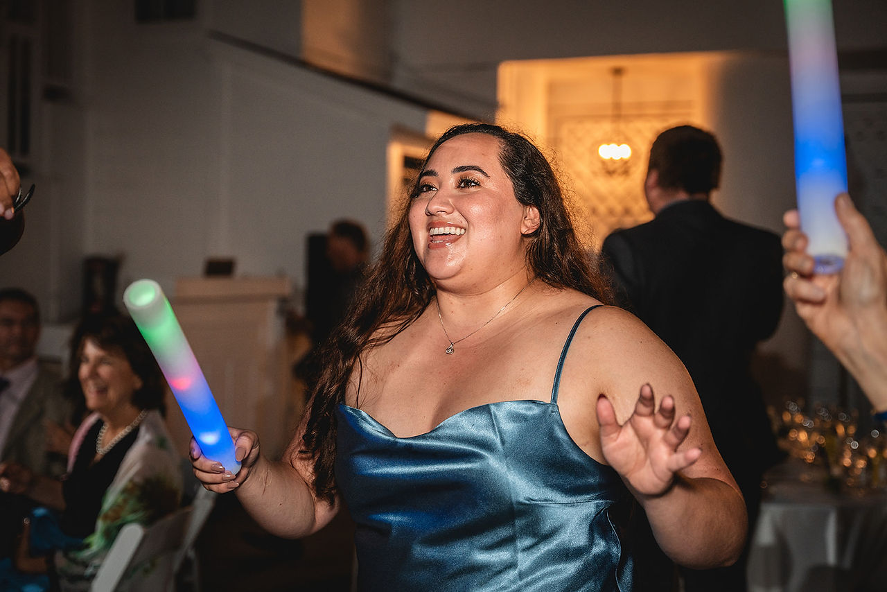Bridesmaid dances at Wedding Reception at Occasions at Laguna Village in Laguna Beach photo by Paper Birch Collective, California Wedding Photographer in Orange County