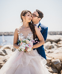 Newly weds kiss after ceremony at Portofino Hotel and Marina, taken by Paper Birch Collective, California Wedding Photographe