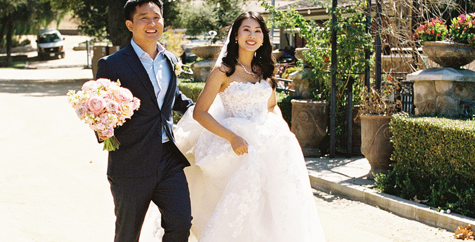 Newly weds walk together at Giracci Vineyards shot by Alvis Pham Photography, Orange County California Wedding Photographer