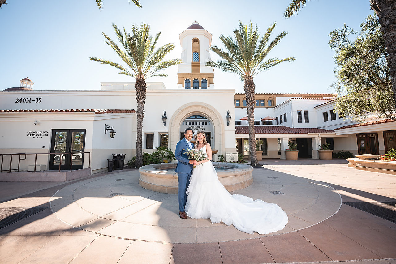 Newly weds in front of Laguna Hills Courthouse fountain shot by Paper Birch Collective, Southern California Wedding Photographer in Orange County