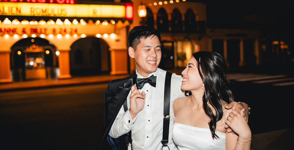 Bride and groom walk outside the Arlington Theater shot by Alvis Pham Photography, Orange County California Wedding Photographer