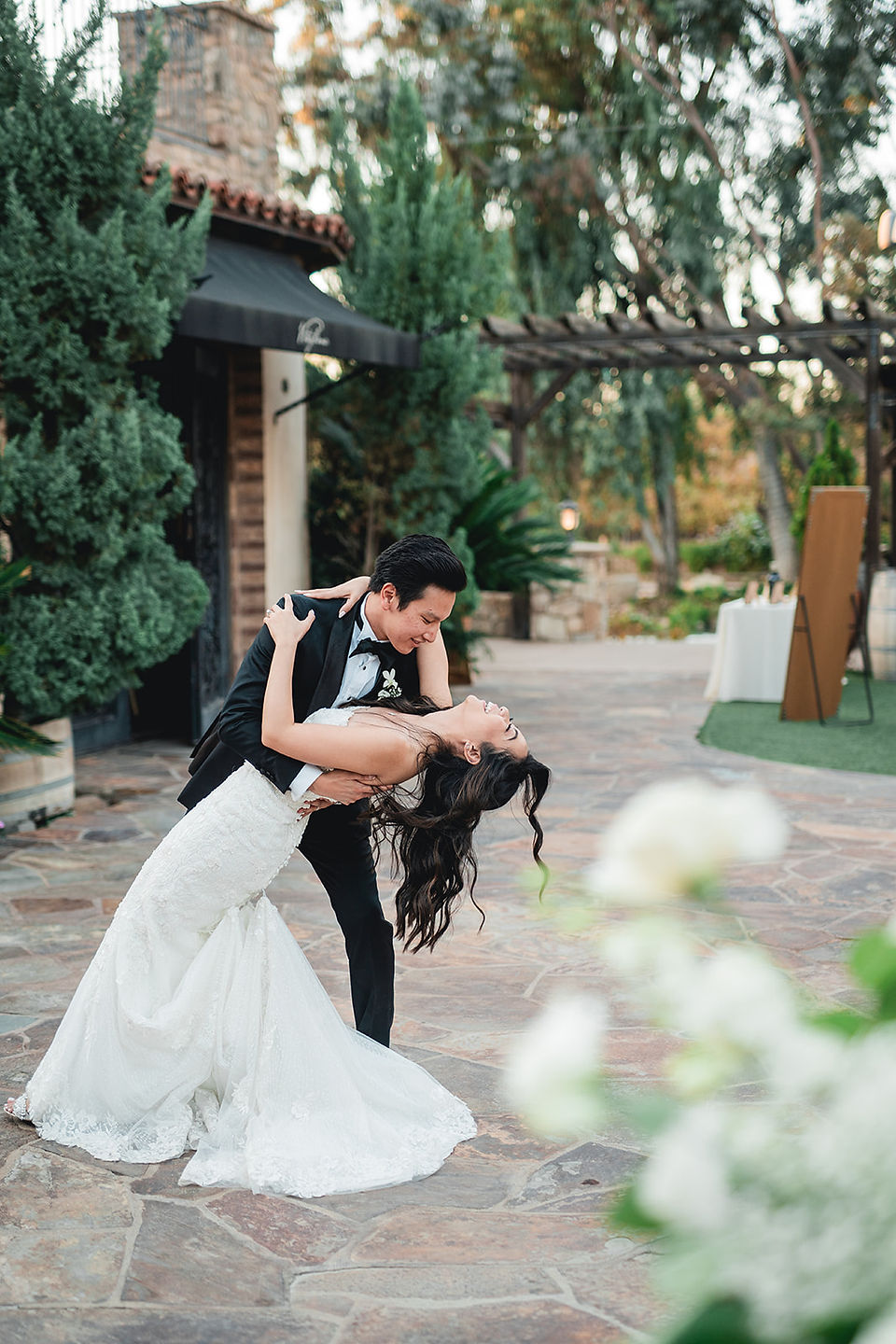 Bride and groom first dance dip at wedding reception at Lake Oak Meadows in Temecula captured by Alvis Pham Photography, Orange County Wedding Photographer in SoCal